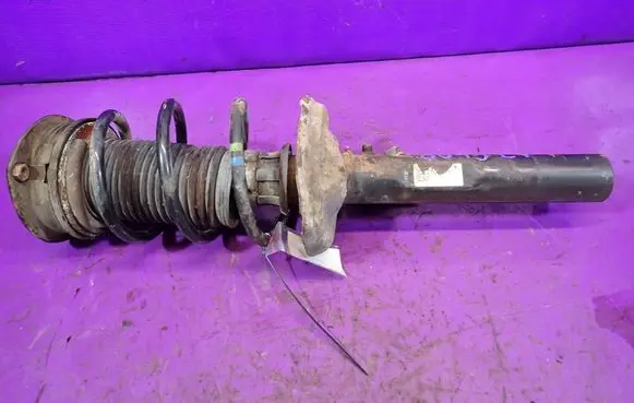 Volkswagen Golf VII Front shock absorber with coil spring 