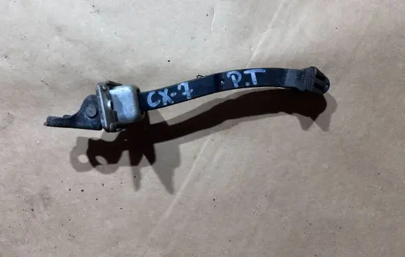 Mazda CX-7 Rear door check strap stopper
