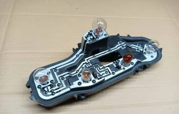 Tail light bulb cover holder
