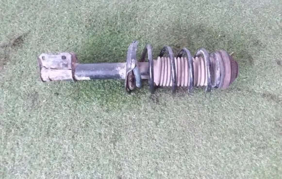 Opel Astra H Front shock absorber with coil spring 24466545 22214604