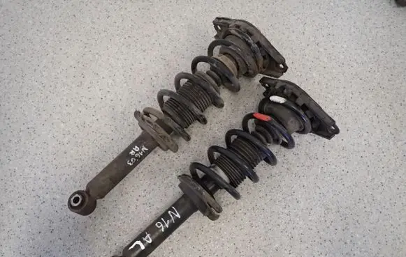 Nissan Almera N16 Front shock absorber with coil spring 