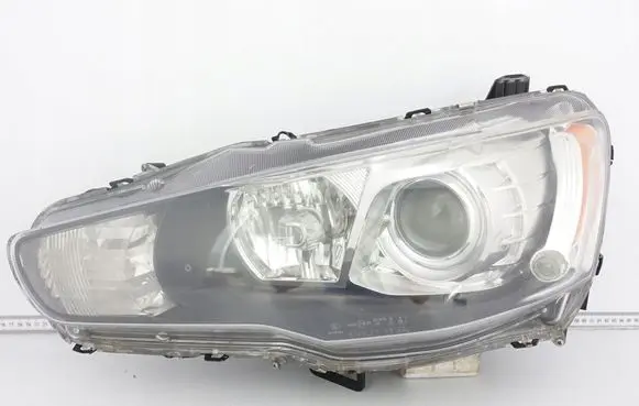 Mitsubishi Lancer VIII Headlight/headlamp 9955949700