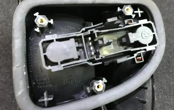 Tail light bulb cover holder