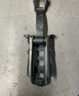 Front door check strap stopper