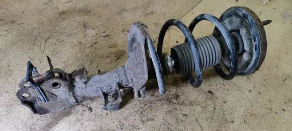 Mitsubishi Lancer VIII Front shock absorber with coil spring
