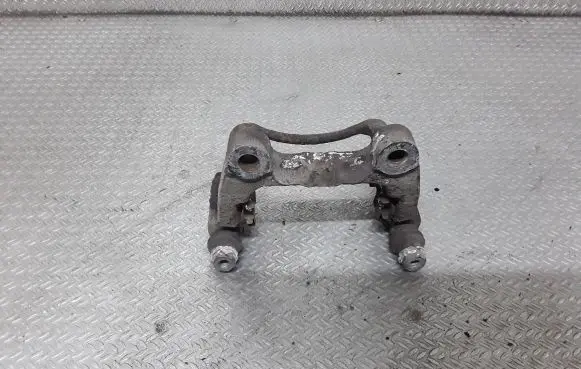 Volkswagen PASSAT B6 Brake caliper pad carrier rear 