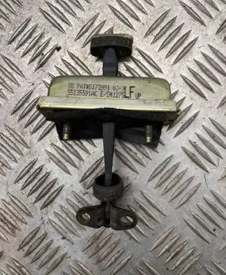 Front door check strap stopper