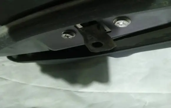 Front door check strap stopper