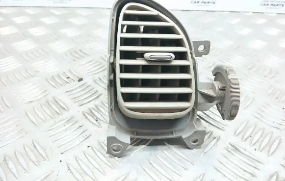 Nissan Almera Tino Dash center air vent grill 68761BU200