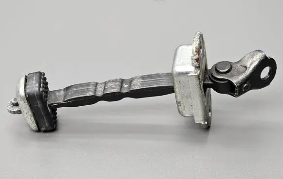 Front door check strap stopper