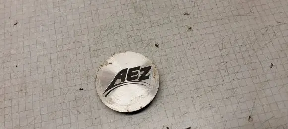 Volkswagen Golf V Original wheel cap 1035E003 57MM AEZ