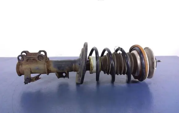 Cadillac CTS Front shock absorber with coil spring