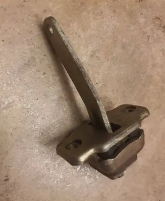 Front door check strap stopper