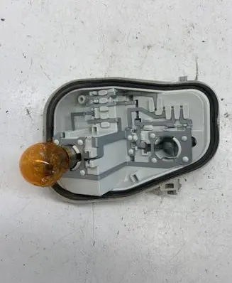 Tail light bulb cover holder
