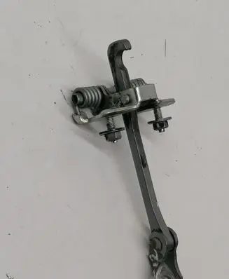 Front door check strap stopper