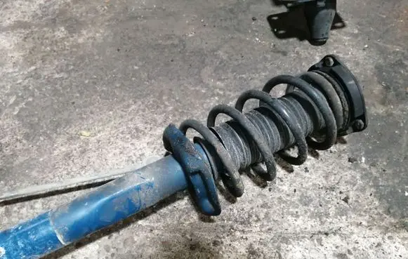 Volkswagen PASSAT B7 Front shock absorber with coil spring