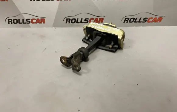 Front door check strap stopper