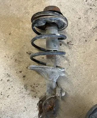 Mitsubishi Carisma Front shock absorber with coil spring