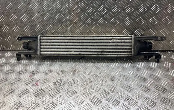 Opel Corsa D Intercooler radiator 872051000