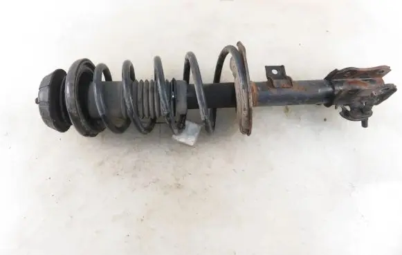Suzuki Swift I Front shock absorber with coil spring 4160163J11