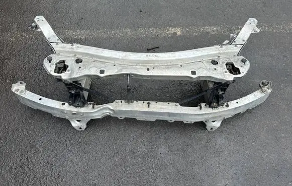 Top upper radiator support slam panel