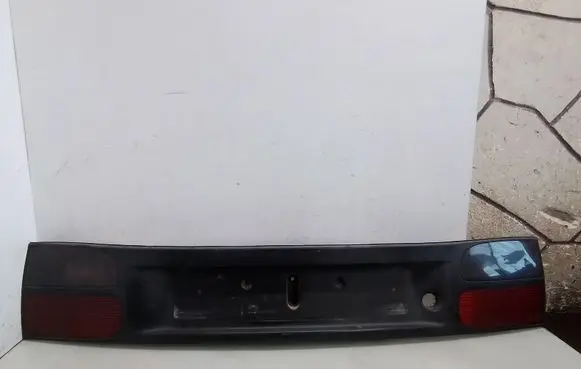 Renault Laguna I Trunk door license plate light bar 7703072198