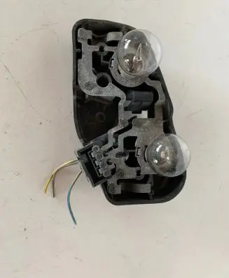 Tail light bulb cover holder