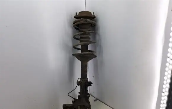 Subaru Forester SF Front shock absorber with coil spring