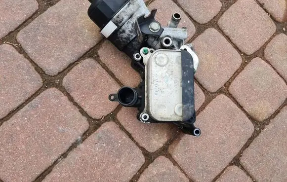 Opel Astra J Oil filter mounting bracket 55238292