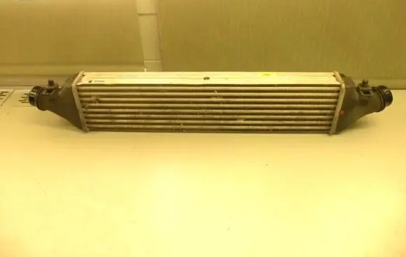 Opel Corsa D Intercooler radiator 55702171