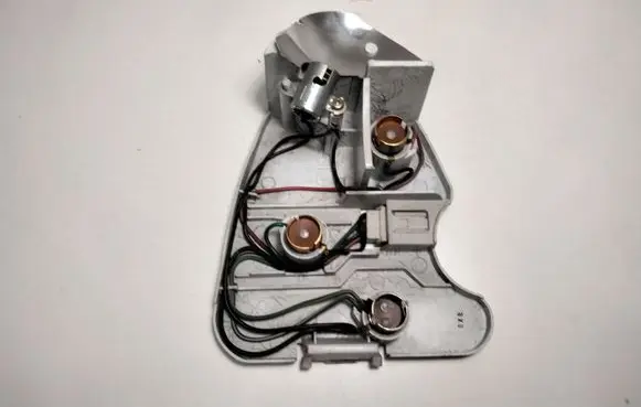 Tail light bulb cover holder
