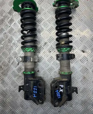 Subaru Legacy Front shock absorber with coil spring