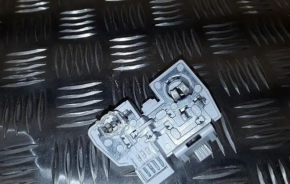 Tail light bulb cover holder