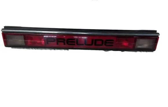 Trunk door license plate light bar