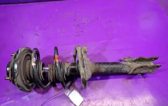 Nissan X-Trail T30 Front shock absorber with coil spring 