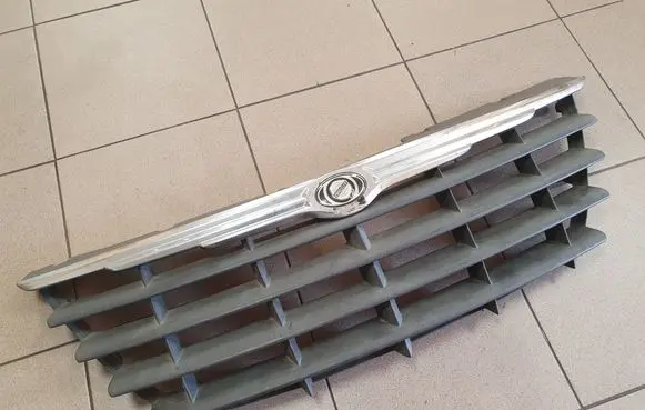 Chrysler Grand Voyager IV Front bumper upper radiator grill 04857960AA