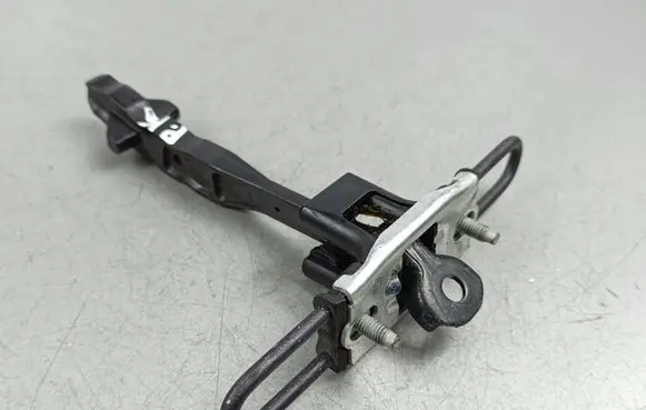 Front door check strap stopper