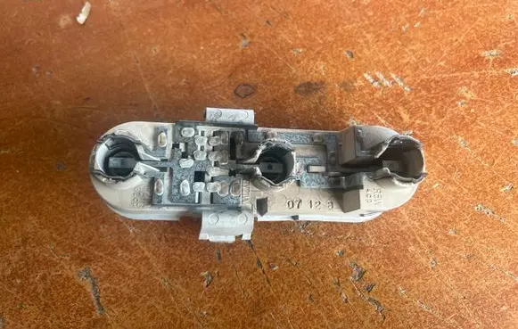 Tail light bulb cover holder