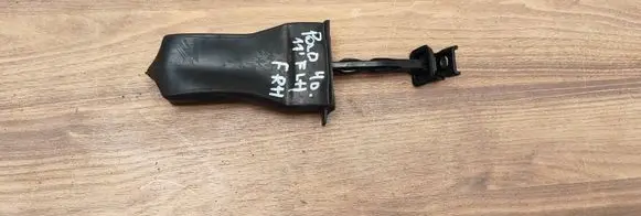 Front door check strap stopper