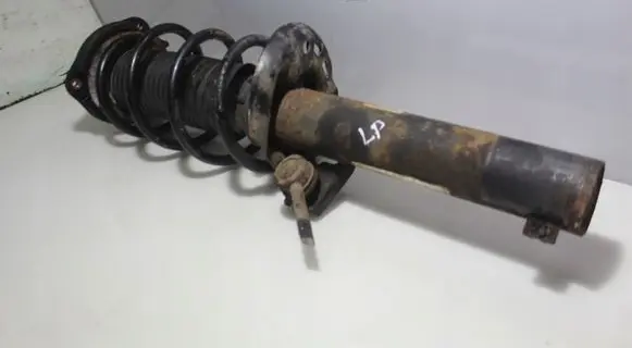 Volkswagen Golf VI Front shock absorber with coil spring