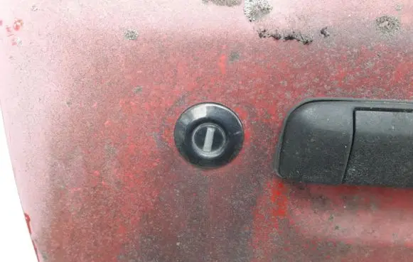 Mazda 323 Front door lock (next to the handle) 