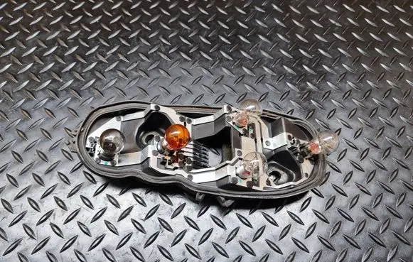 Opel Corsa D Tail light bulb cover holder 89037853A