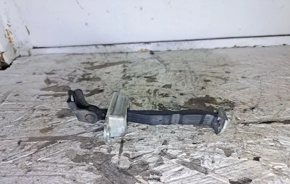 Nissan Pulsar Front door check strap stopper
