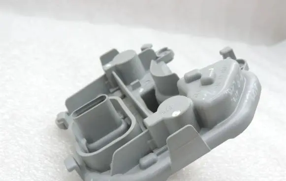 Tail light bulb cover holder