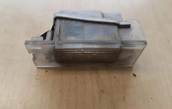 Renault Laguna II Number plate light 7700796163