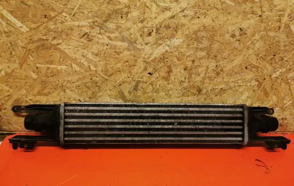 Opel Corsa D Intercooler radiator 55702004