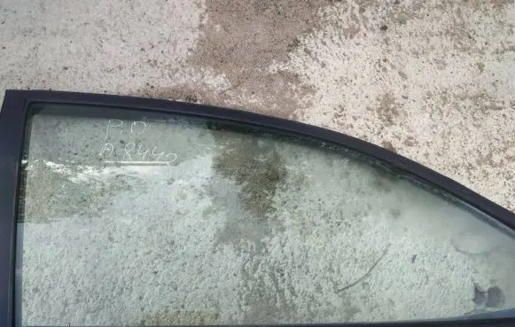 Mazda 323 Front door window glass four-door