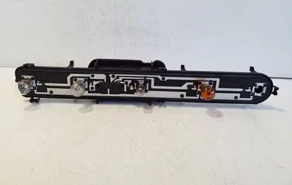 Tail light bulb cover holder