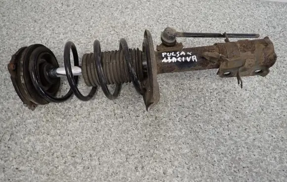 Nissan Pulsar Front shock absorber with coil spring