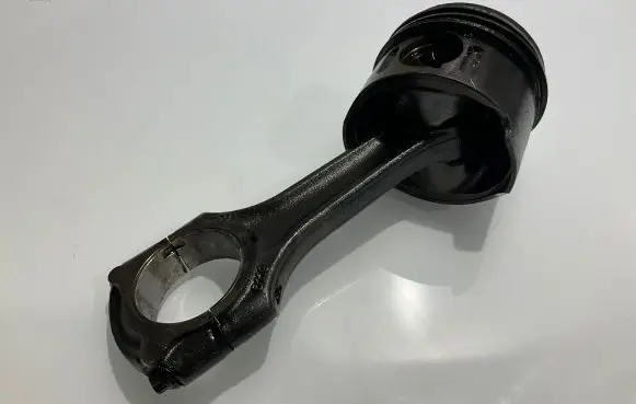 Piston with connecting rod